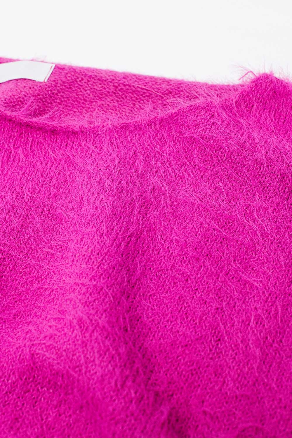 su&eacute;ter corto esponjoso en fucsia ajustado a la cintura