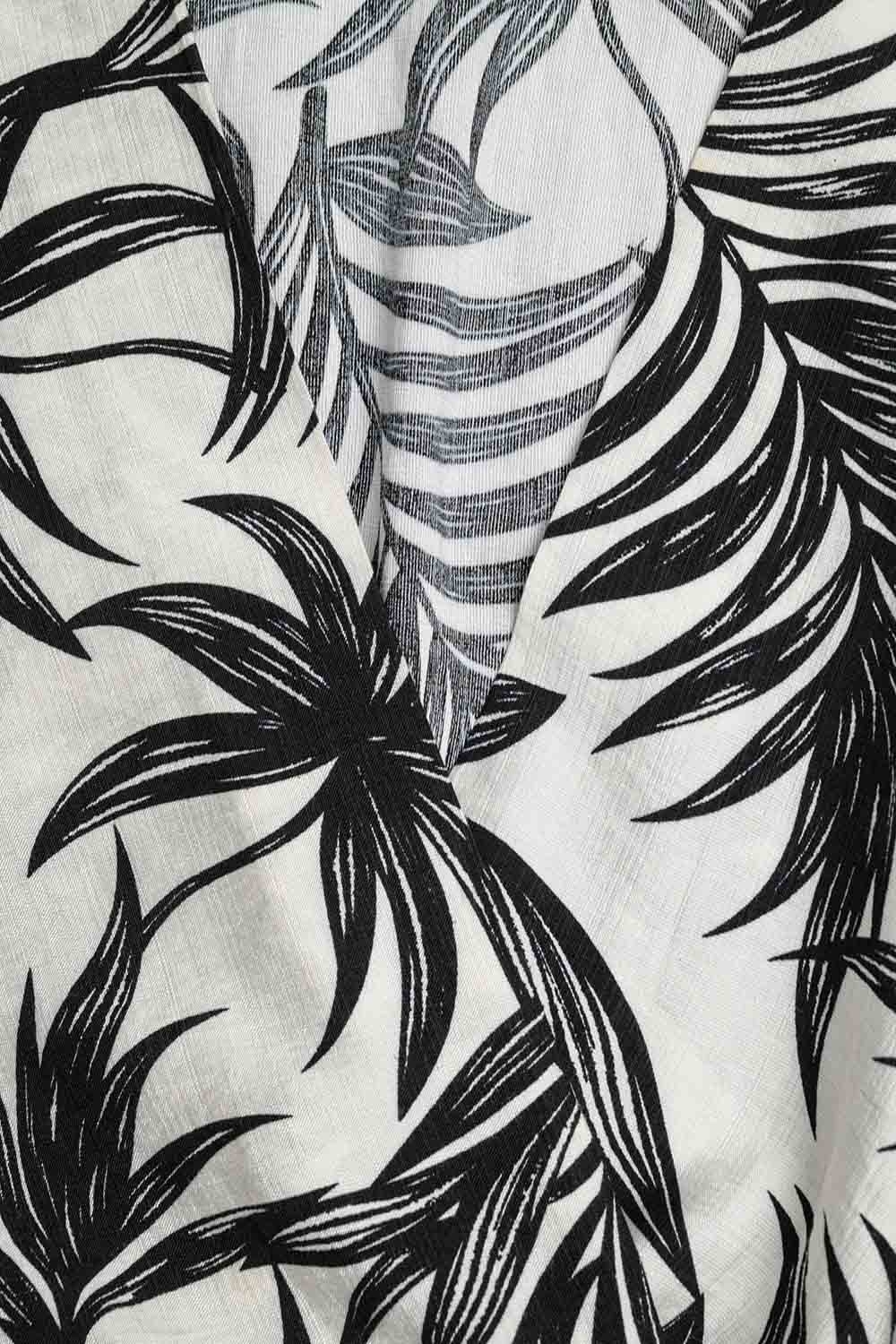 Top corto en blanco con motivo tropical en negro Top corto en blanco con motivo tropical en negro