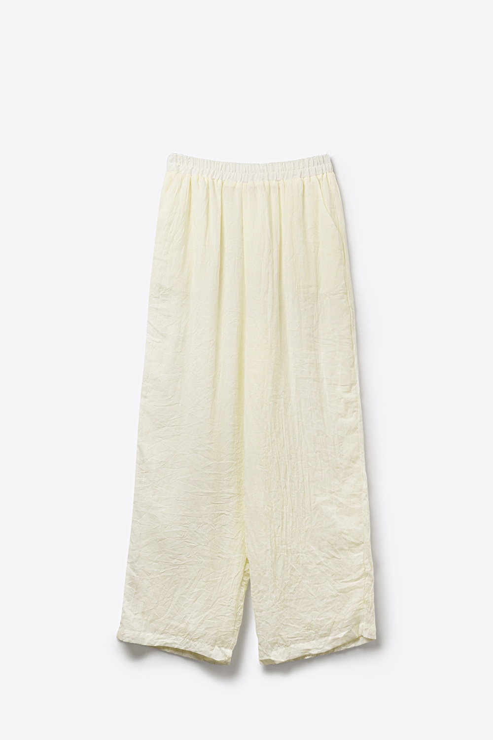 Pantalones anchos color crema con tela transparente