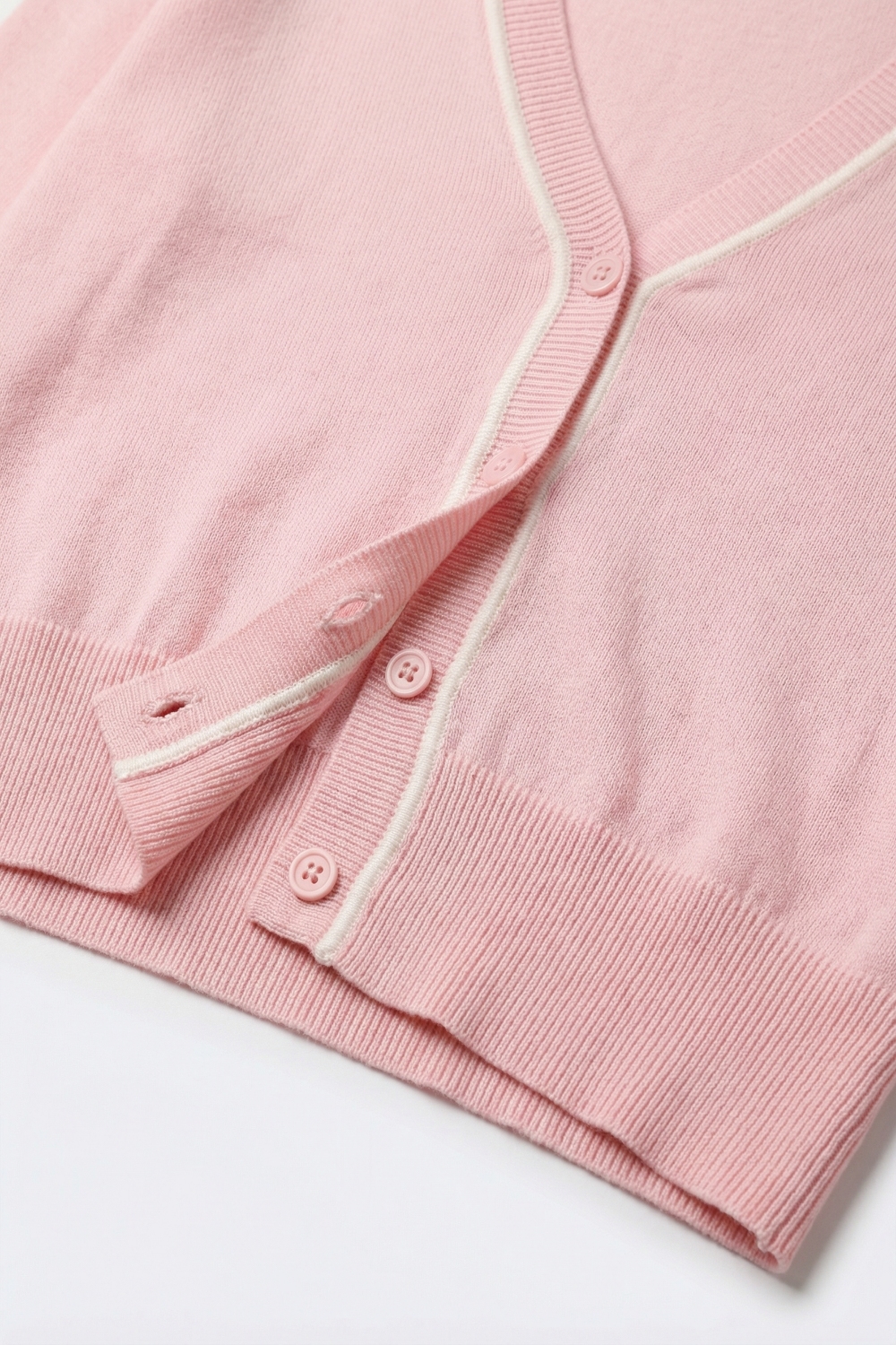 C&aacute;rdigan de punto fino rosa con ribete a contraste en blanco