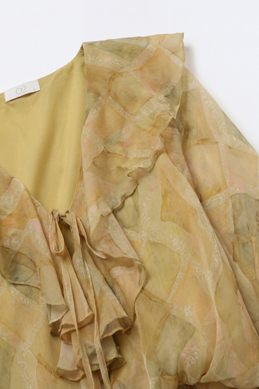 Blusa Transparente con Detalle de Volantes Mostaza y Lazo Frontal
