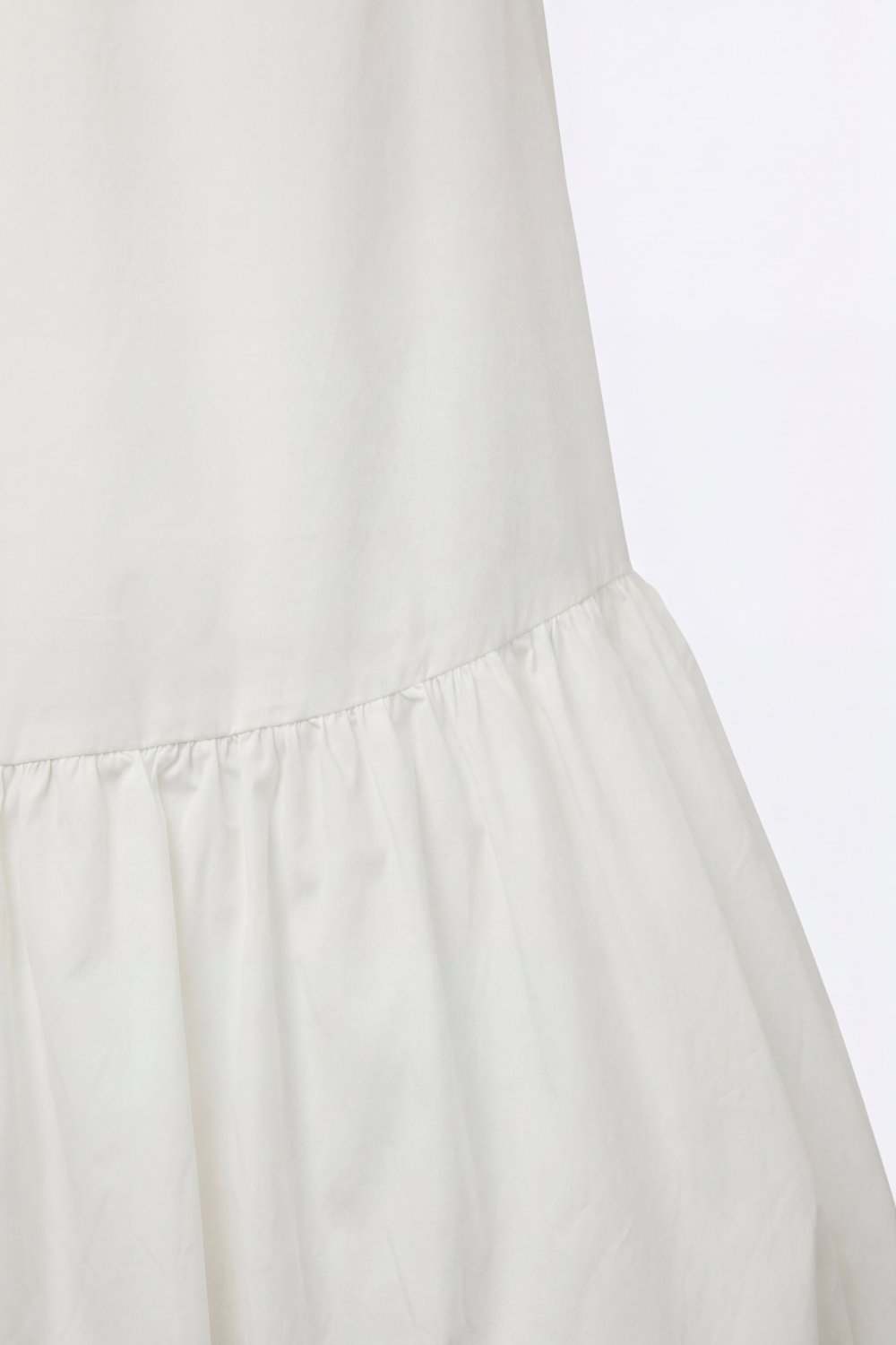 Vestido de popelina blanca sin mangas con dobladillo estilo globo