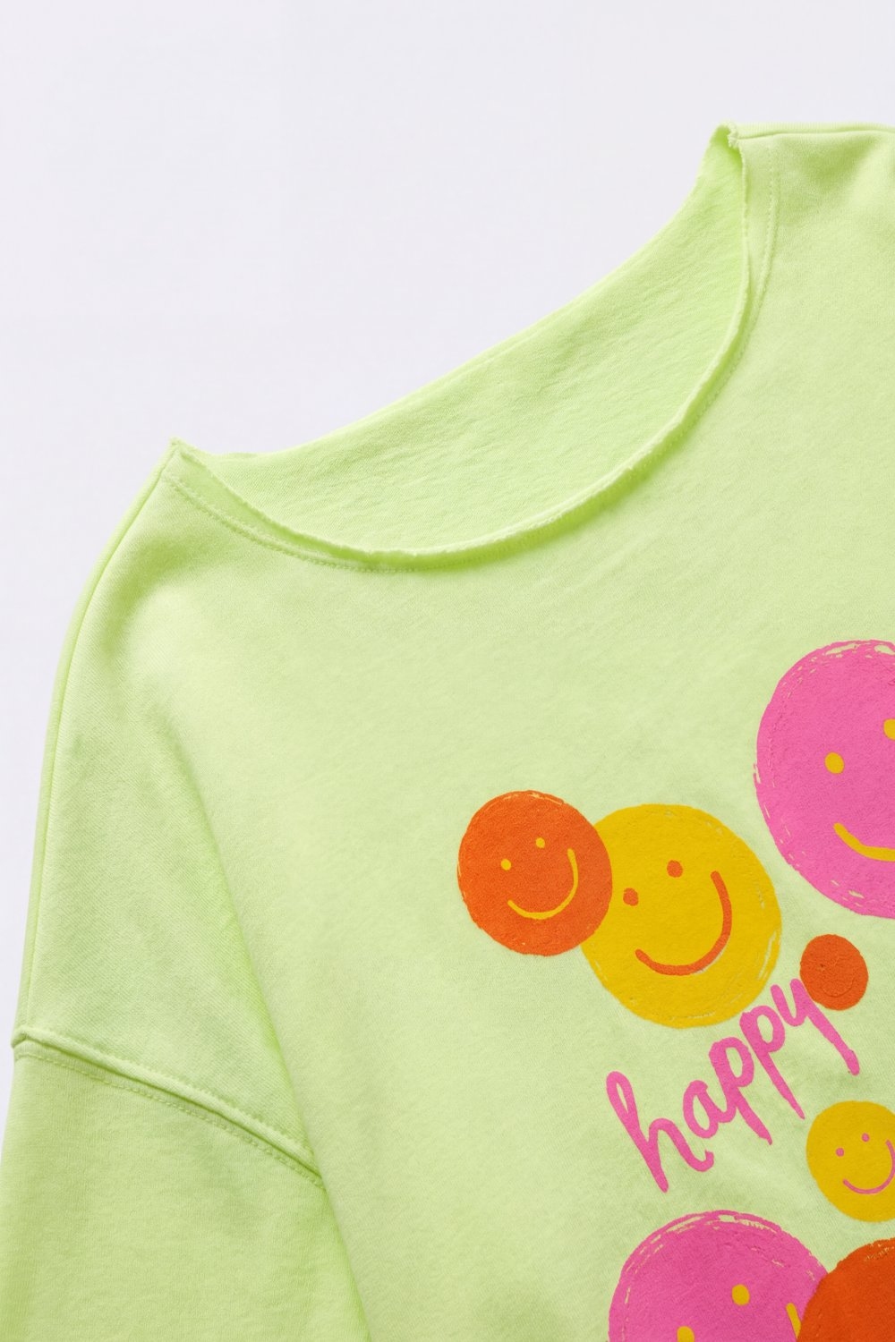 Sudadera gr&aacute;fica de ajuste holgado en verde claro con sonrisa