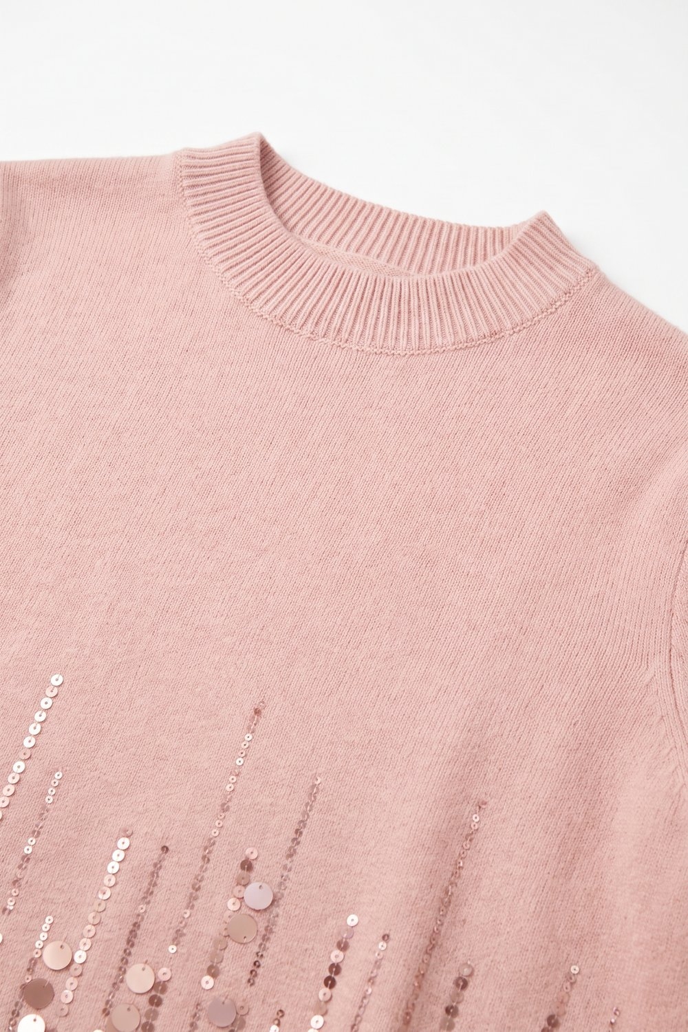 Top de punto fino rosa claro con dobladillo de lentejuelas y manga corta