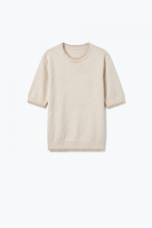 Suéter beige de manga corta con cuello redondo y ribete de piel sintética