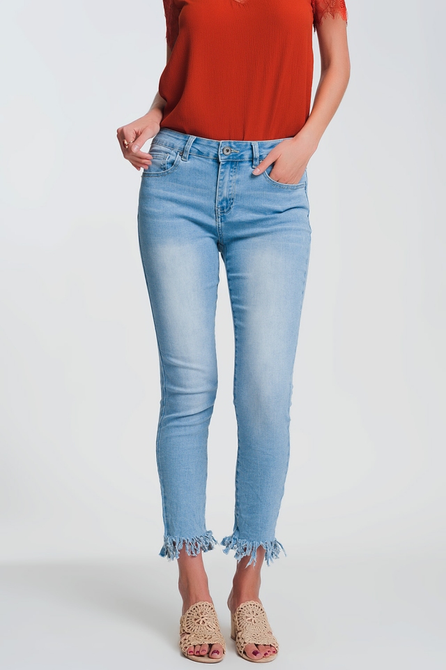 Jeans skinny azzurri con bordo sfrangiato