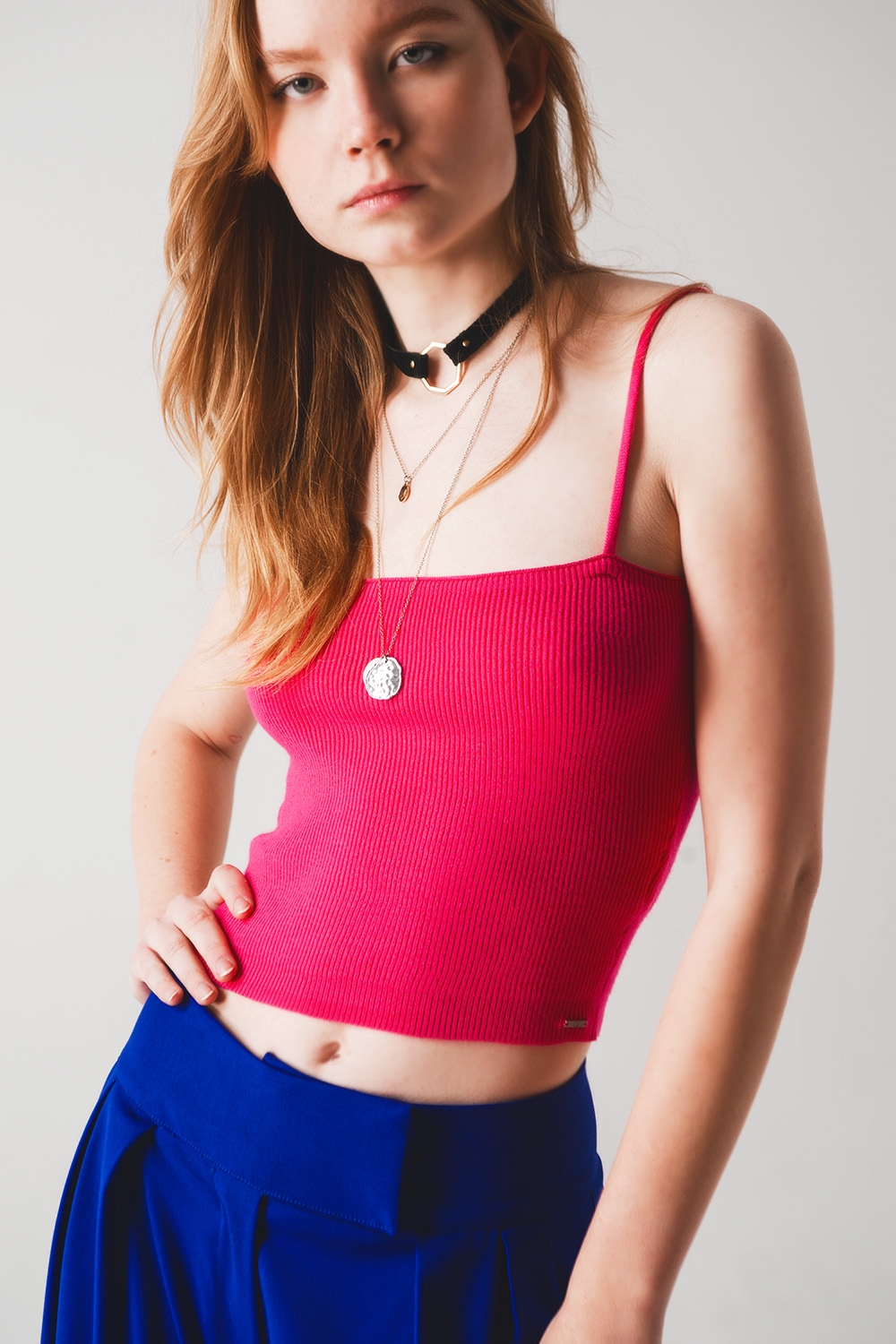 Top fucshia sin mangas de punto de canalé Top fucshia sin mangas de punto de canalé