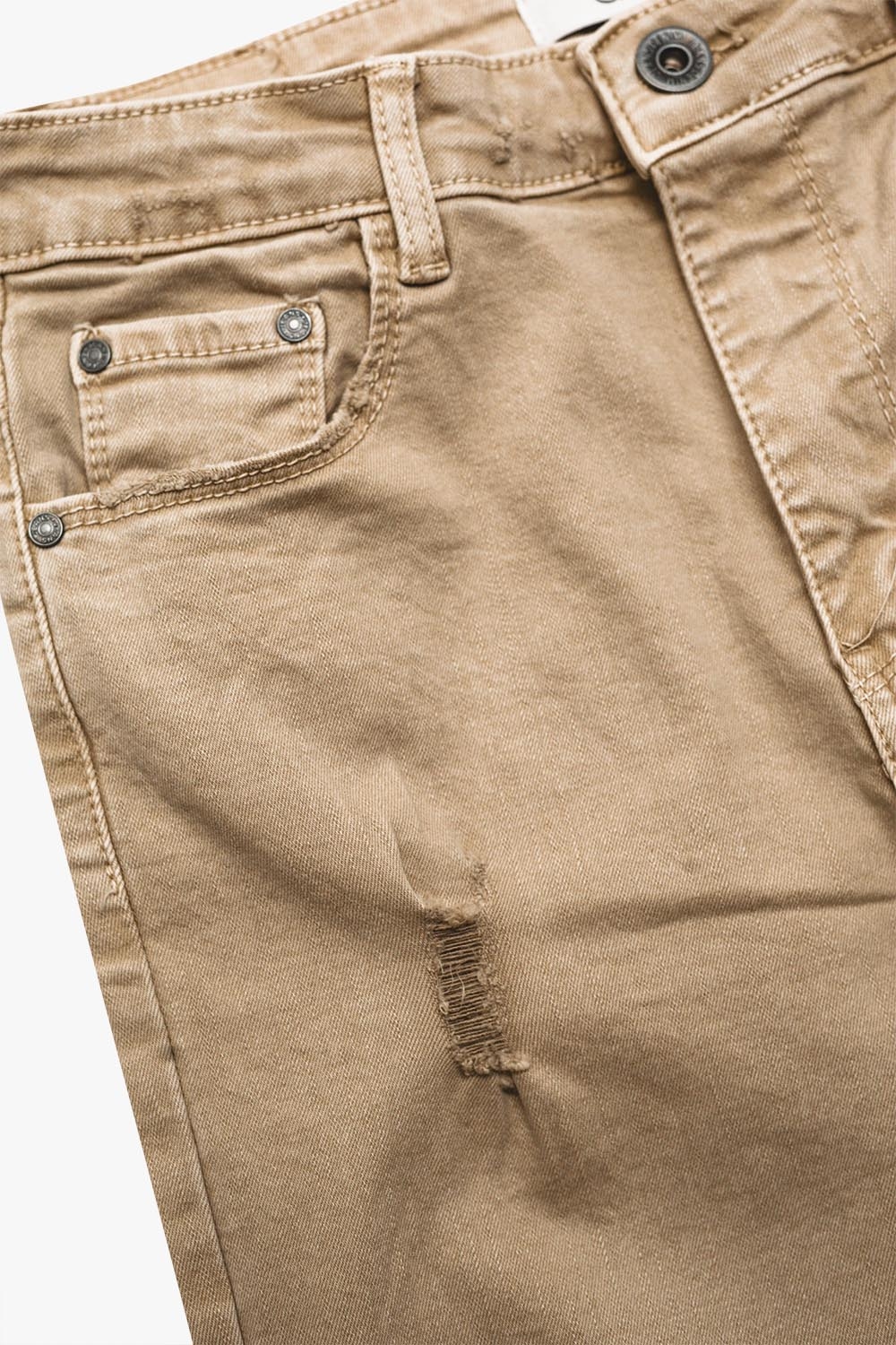 Vaqueros beige de talle alto y corte pitillo Vaqueros beige de talle alto y corte pitillo