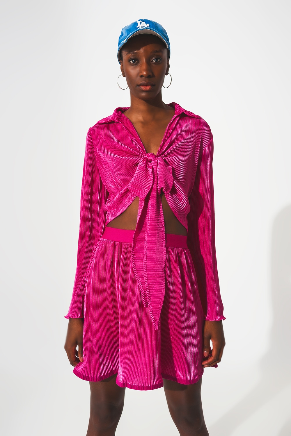 Top plisado anudado al frente en fucsia Top plisado anudado al frente en fucsia