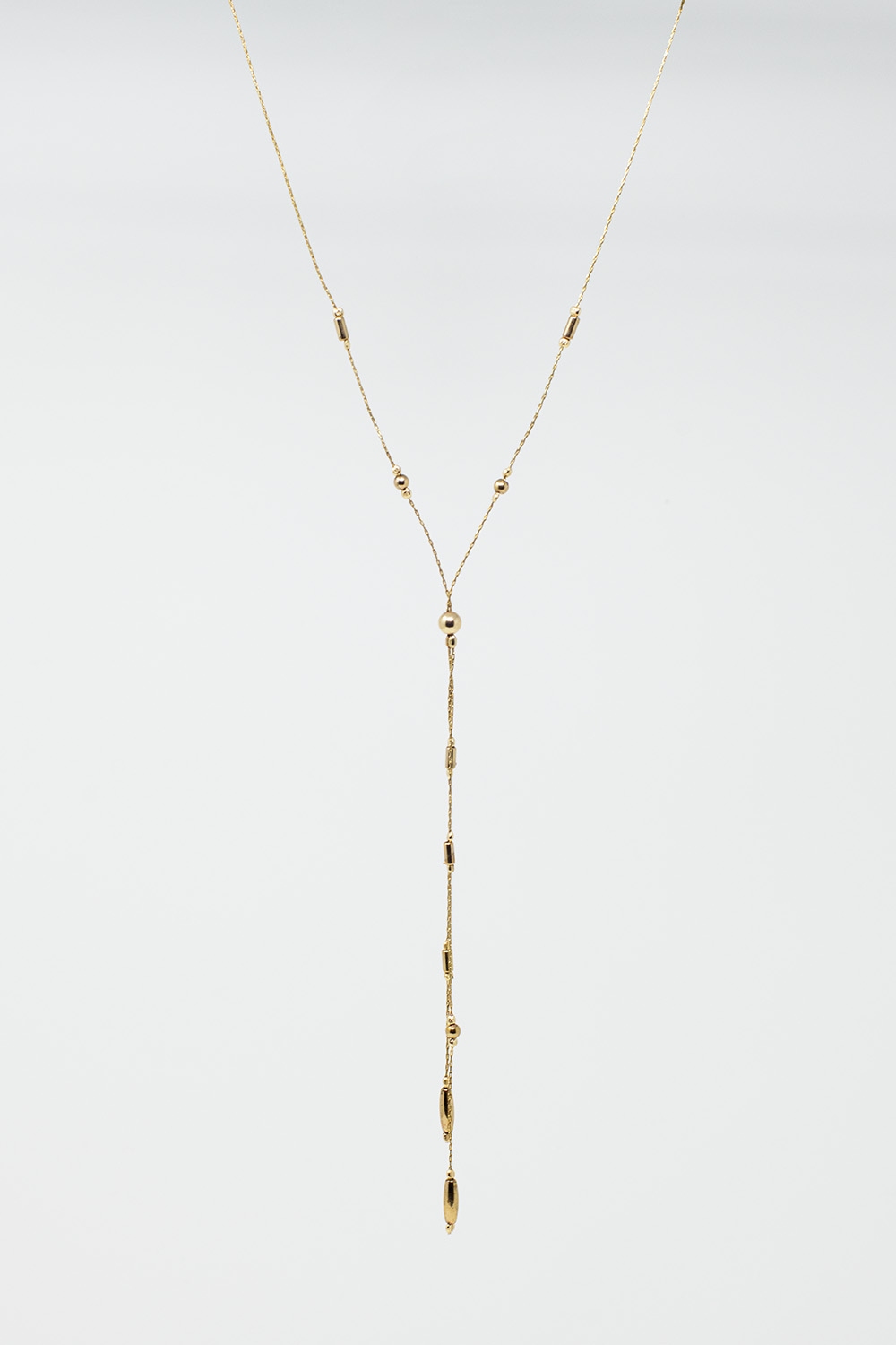 Collar largo dorado con cuentas doradas y borla dorada larga Collar largo dorado con cuentas doradas y borla dorada larga